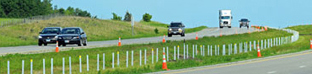 Orange barrels on a highway