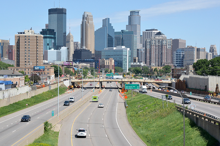 Freeway leading into Minneapolis with skyline in background